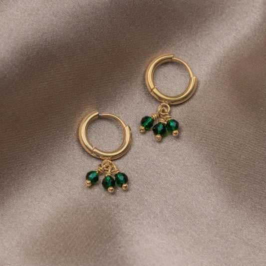 Single earrings with triple green zirconia in gold