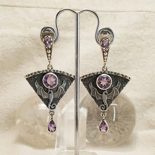 Vintage earrings made of silver and purple zirconia