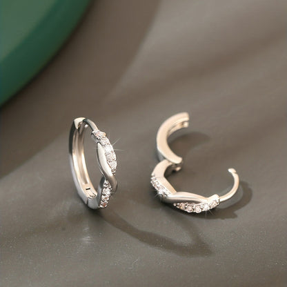 Lunarya | Women's elegant twisted earrings with zirconia | Golden yellow