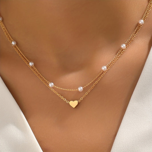 Meliora | Women's delicate pearl necklace with heart pendant | Gold