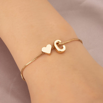 Liora | Women's minimalist heart bracelet with letter beads | Gold